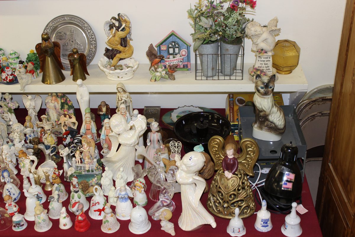 Shelves of figurines and collectibles at Franklin County estate auction